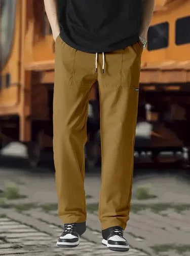 Men's casual polyester trousers for spring and autumn in light grey colour.