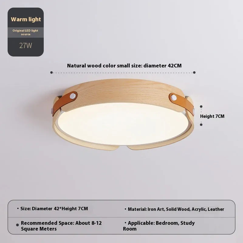 Japanese style wooden ceiling lamp with a round PMMA lampshade in warm light colour.