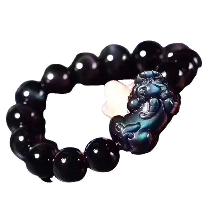 Natural ice colour Eye Obsidian crystal bracelet showing semi-translucent beads on wrist