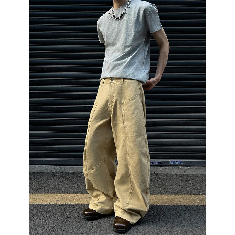 Men's khaki coloured straight-leg cotton casual trousers laid flat, showcasing the retro style and solid colour.