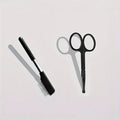 Black pet grooming brush with soft bristles for tear stain removal and integrated comb section