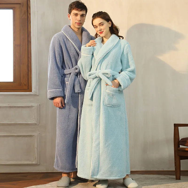 A man and woman wearing matching thickened flannel couple's bathrobes in a winter colour.