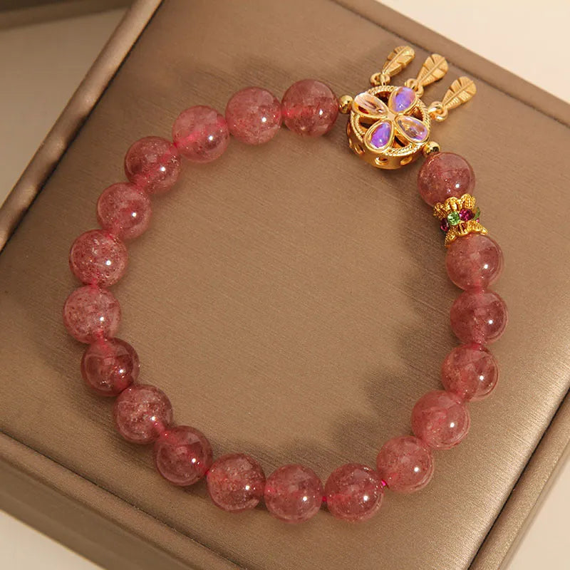 Women's crystal bracelet with strawberry quartz dream catcher ball pendant, original design.