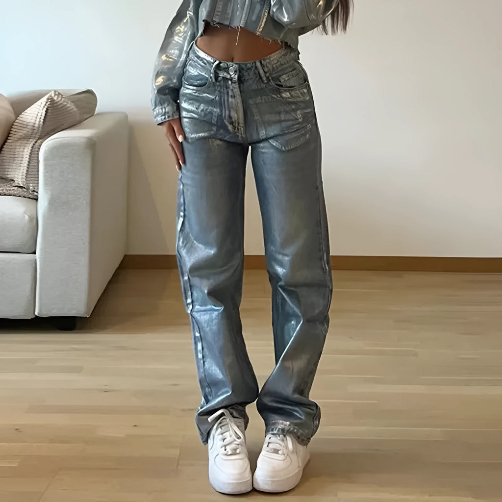 Women's washed blue high waist straight leg jeans with silver contrast details on back pockets
