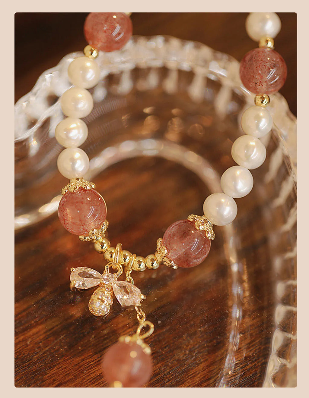 Women's crystal bracelet with strawberry quartz pearls and bow design