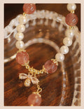 Women's crystal bracelet with strawberry quartz pearls and bow design