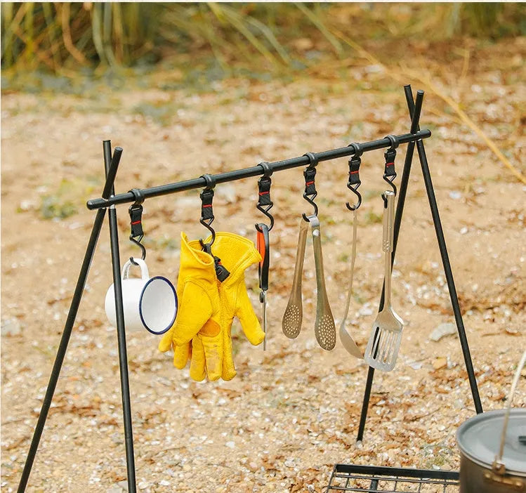 Silver aluminium foldable triangle camping clothes drying rack with side hanger and multiple hooks.