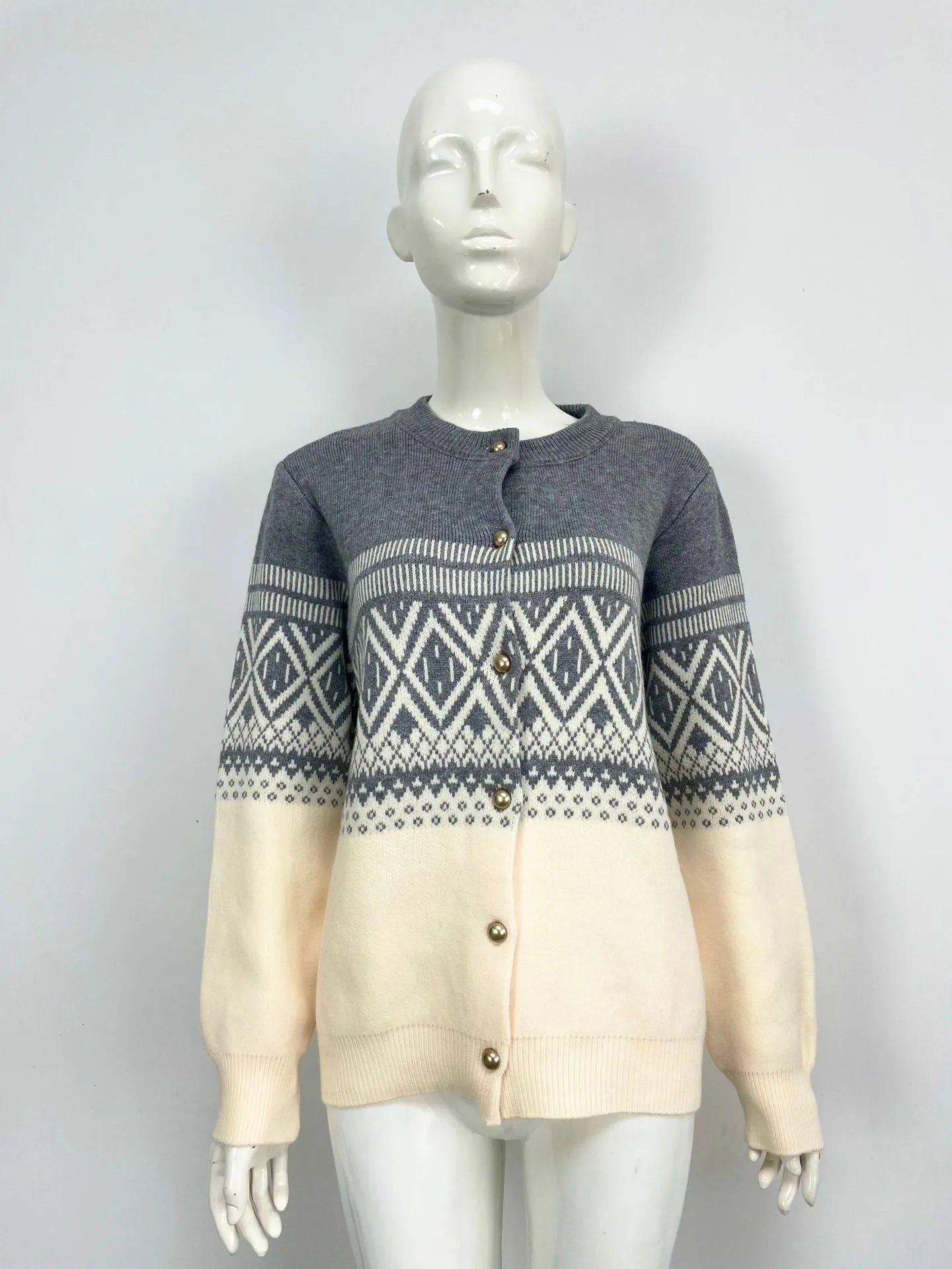 Women's red alpaca wool cardigan with diamond knit pattern and contrast colour long sleeves.