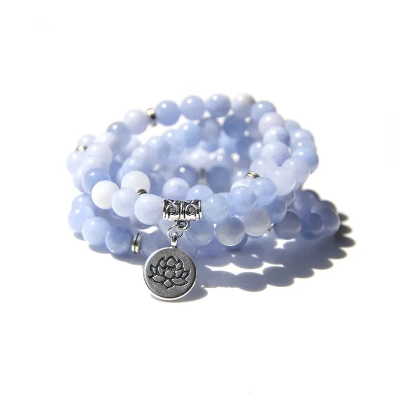 Vintage natural stone bracelet for women with a geometric lotus pendant on a model's wrist.