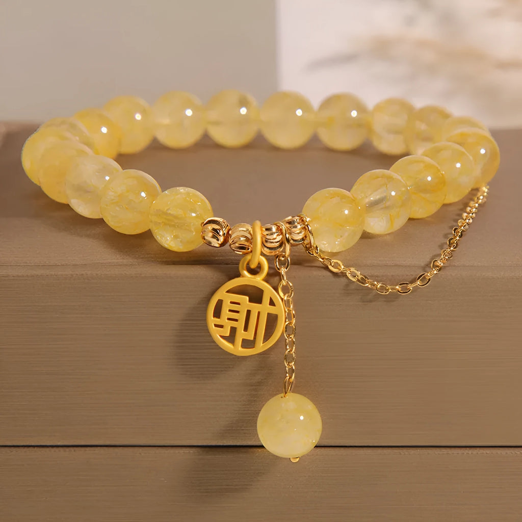 Natural citrine bracelet with gold electroplated Chinese character charm on adjustable tassel