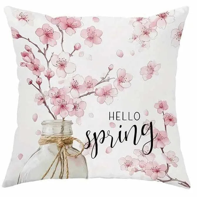Short velvet cushion cover with cherry blossom letter print, 45cm square, shown in one of four colours.