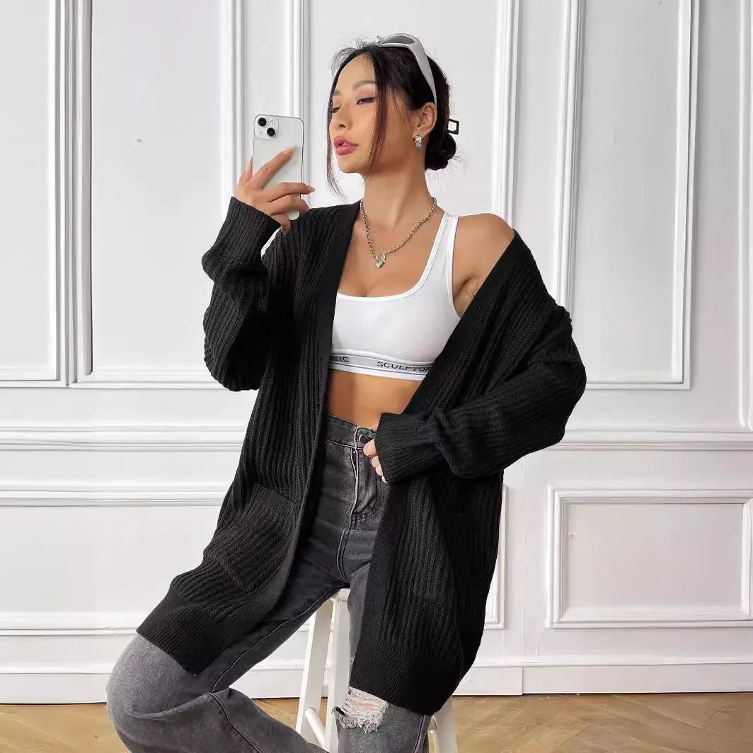 Women's mid-length loose fit cardigan with double pockets in dark green colour