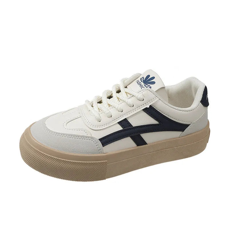 Low top blue board shoes with round toe and flat rubber sole on white background