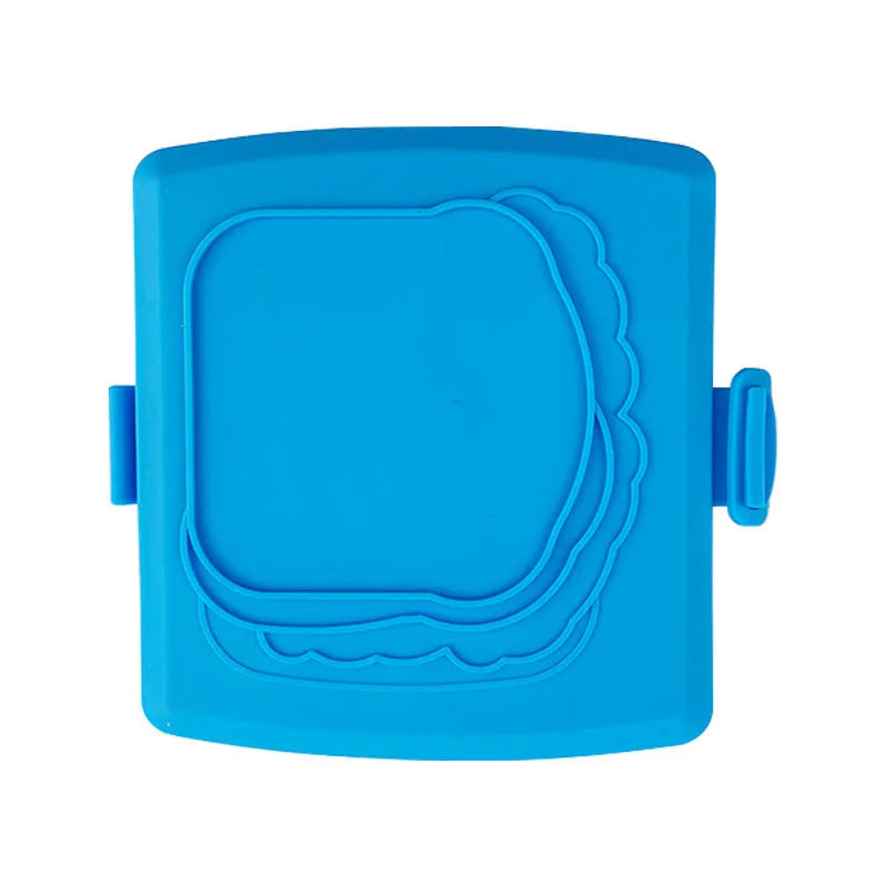 Red silicone baking tray with hand clamp attachment showing anti-scald design