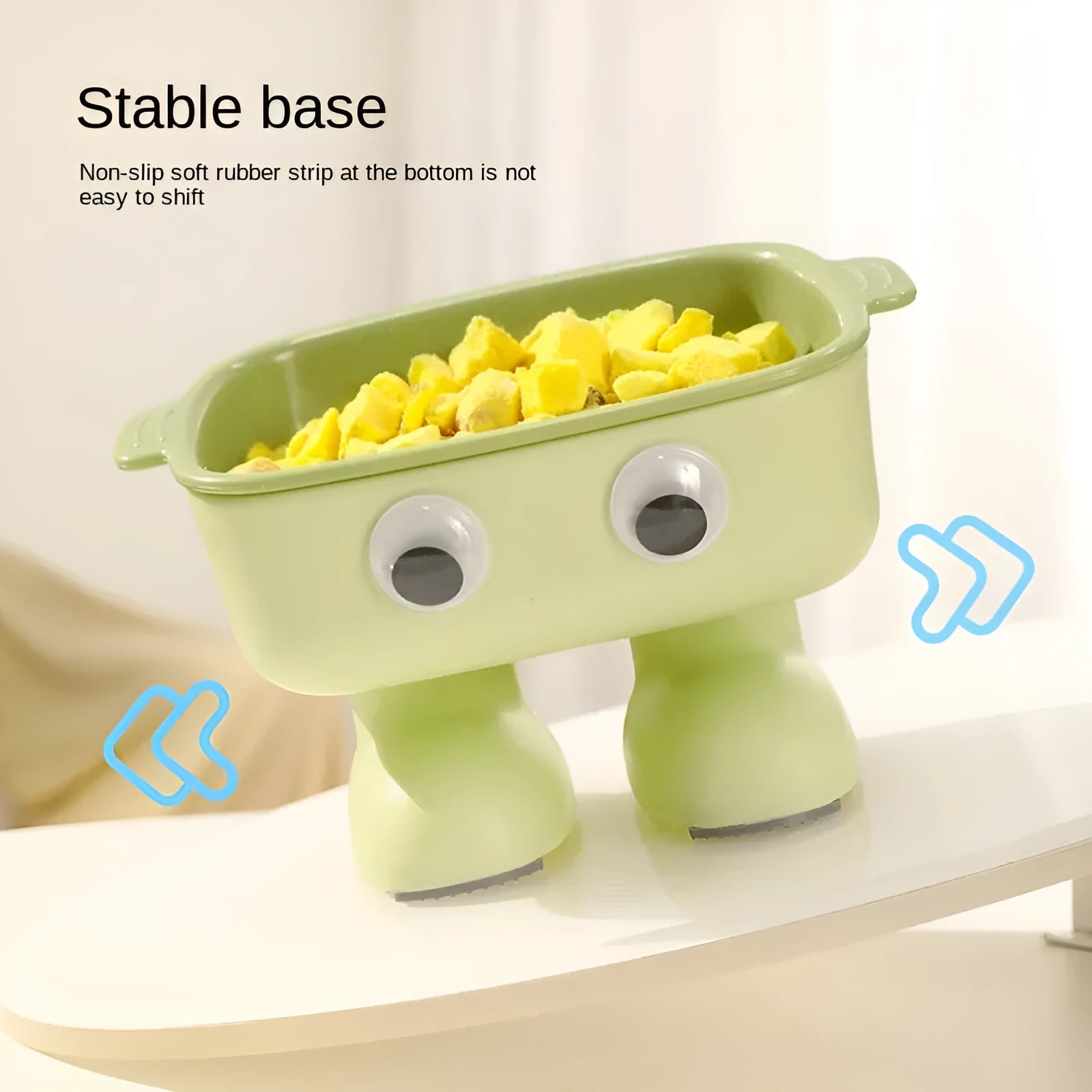 Green robot-shaped elevated cat bowl with tilted food dish and non-slip base.