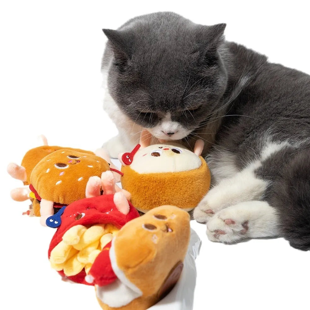 Assorted fast food shaped cat chewing toys including hamburger, chicken leg, bread, fries, and hot dog designs