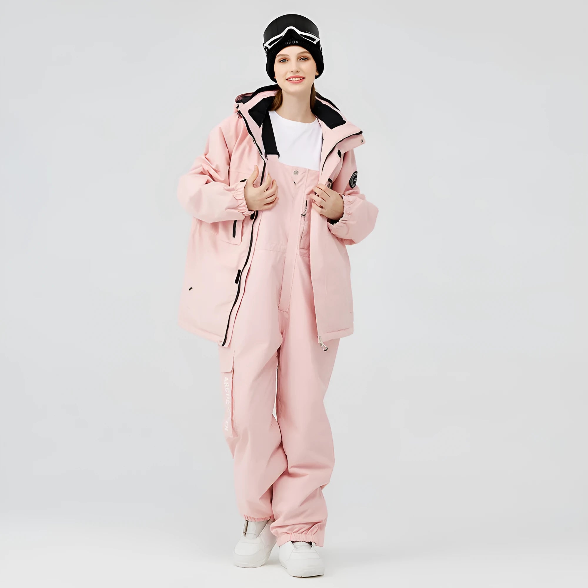 Men's and women's waterproof winter ski suit in blue top with grey blue trousers.