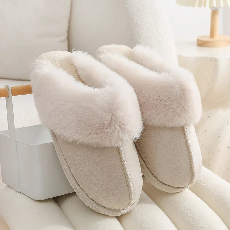 Women's brown plush indoor slippers with artificial wool lining and a textured PVC sole.