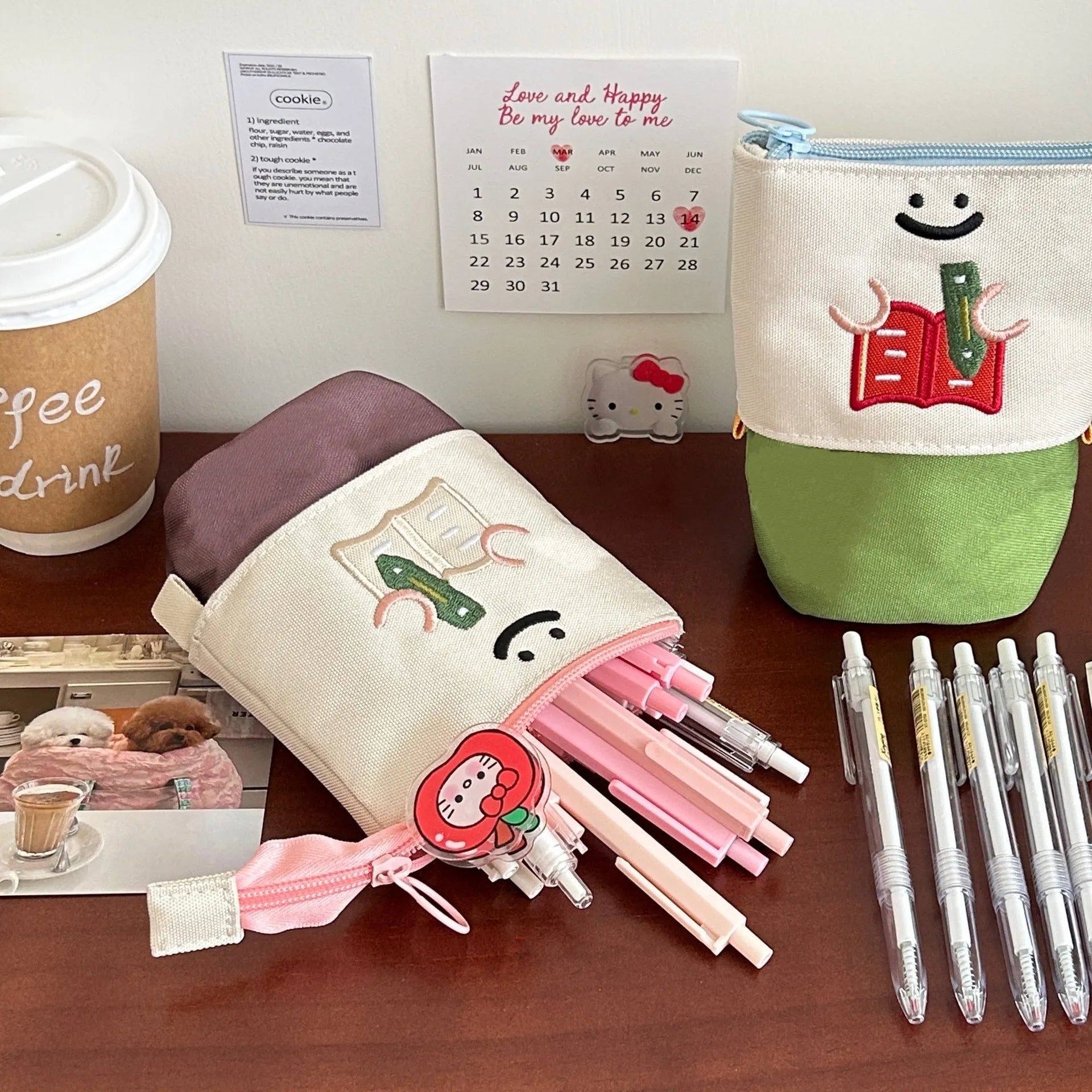 Brown and green cartoon-style collapsible Oxford cloth pencil case showing zip and 17x14cm size.