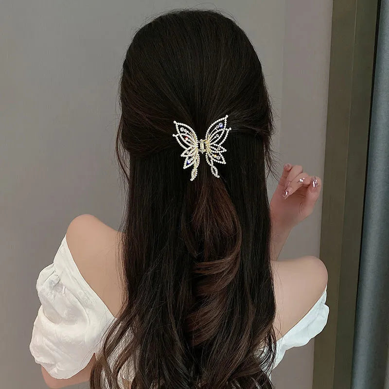 Butterfly hair barrettes in alloy measuring 6.7 by 6.2 cm with decorative elements