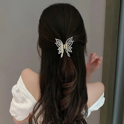Butterfly hair barrettes in alloy measuring 6.7 by 6.2 cm with decorative elements