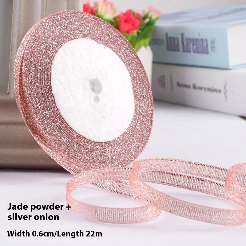 Roll of 0.6cm wide coloured polyester gift ribbon with 22 metre length.