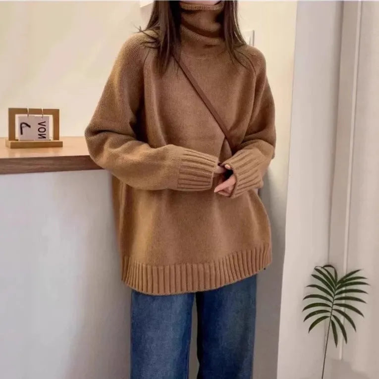 Women's thick loose-fit turtleneck sweater with curling pile collar in red, camel, grey, or black.