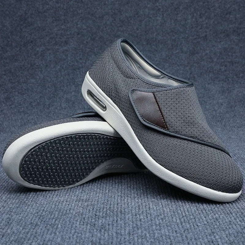 Beige widened fit leisure shoes with Velcro strap and rubber foam sole.