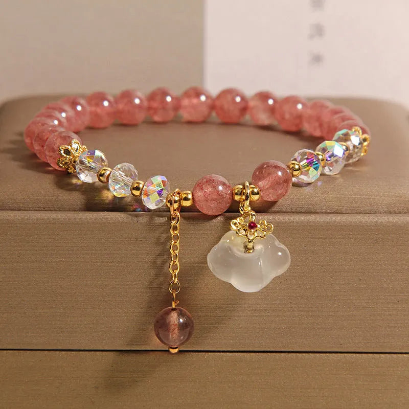 Women's adjustable crystal bracelet with strawberry quartz and white agate beads showing adjustable chain detail