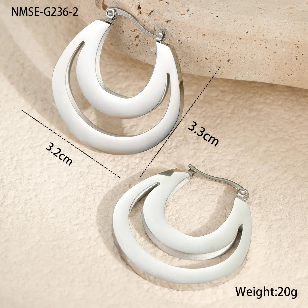 Geometric French hook earrings with round design in gold and steel metallic finishes