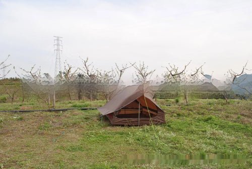Brown A-line pole-free portable tent with hiking cane support showing interior space for 2-3 people