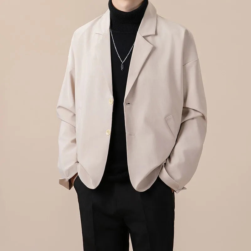 Loose fit light business suit jacket in chemical fibre blend fabric showing regular length and long sleeve design