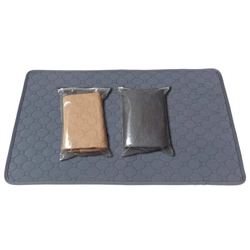 Pet Parents grey and khaki washable dog pee pads in multiple sizes on a wooden floor.