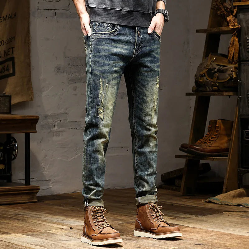 Men's skinny fit stretch jeans in a retro colour, showing zip fly and slim leg cut.