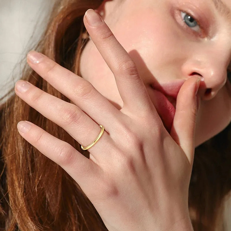 Minimalist geometric bracelet ring in sterling silver, gold, or platinum on a plain background.