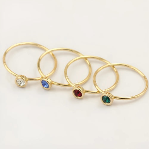 14K gold plated zircon knuckle ring on finger showing copper base with decorative stones