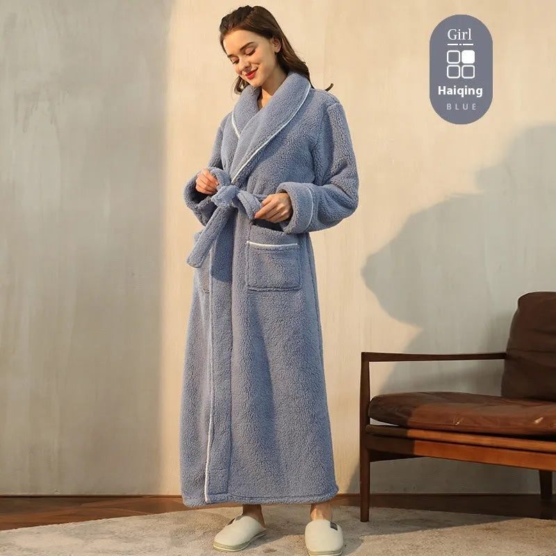 A man and woman wearing matching thickened flannel couple's bathrobes in a winter colour.