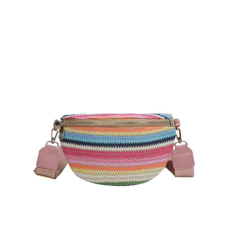 Bohemian style straw beach bag with woven construction, shell shape, and single shoulder strap