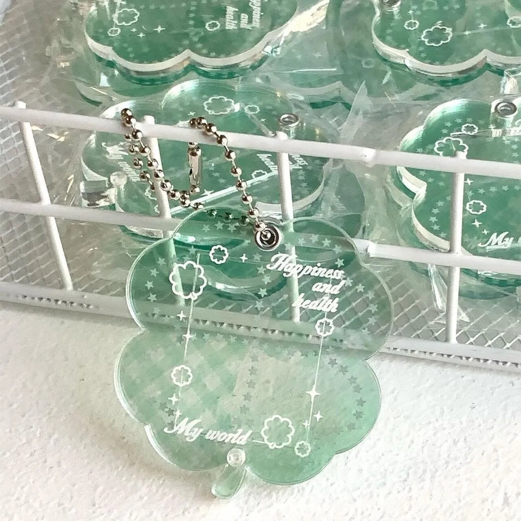 Acrylic four-leaf clover mobile phone pendant keychain in blue, green, and mint colours