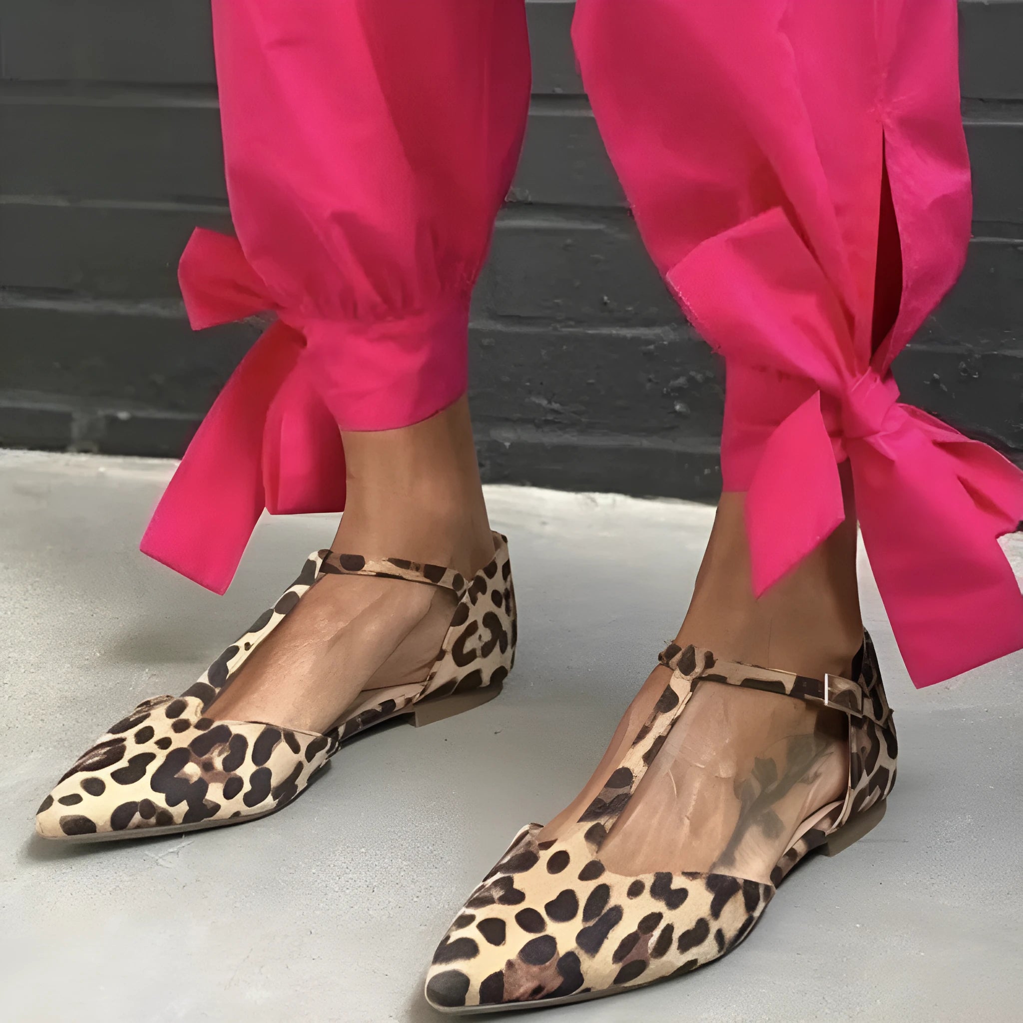 Leopard print women's pumps with pointed toe and low chunky heel on rubber sole