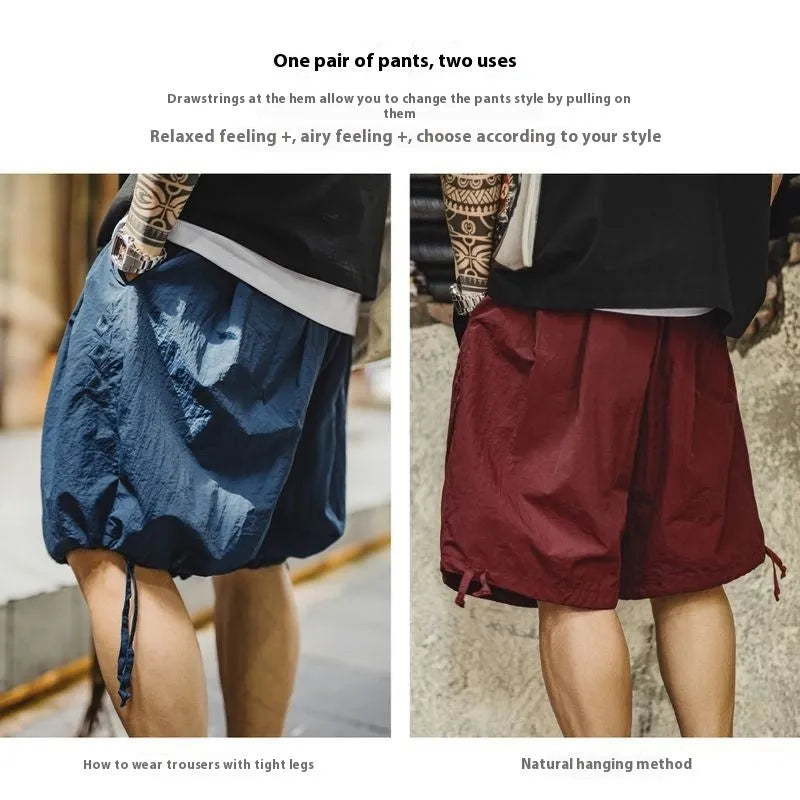 Prussian Blue men's loose fit nylon summer shorts with elastic waist and embroidered details