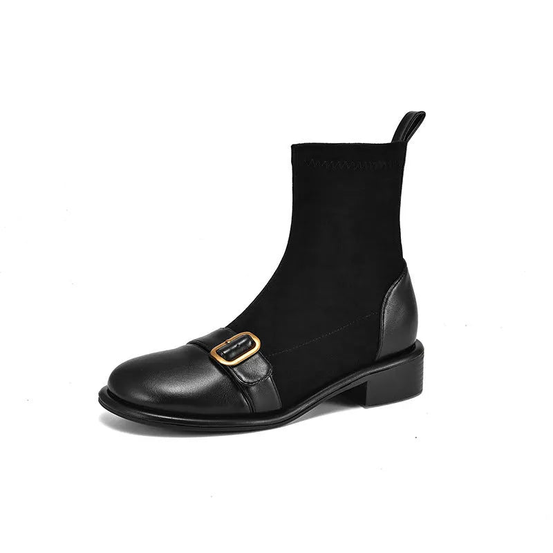 Women's black casual low-heel ankle boots with belt buckle detail and front lace-up closure.