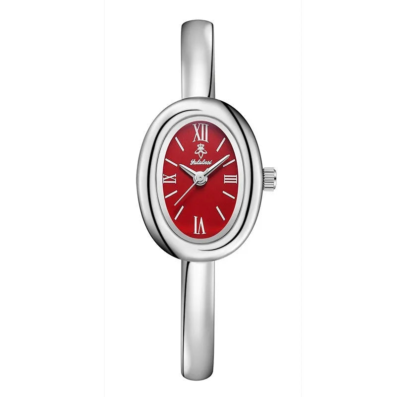 Women's slim oval retro quartz watch in gold colour on wrist