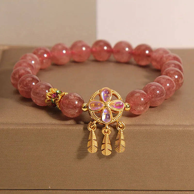 Women's crystal bracelet with strawberry quartz dream catcher ball pendant, original design.