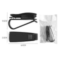 Black plastic car sunshade clip for holding glasses and cards on a vehicle visor.