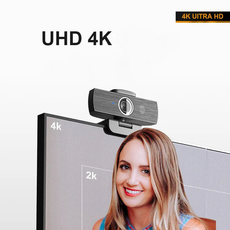 Black USB computer webcam with magnetic privacy cover on a laptop screen
