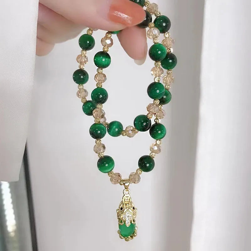 Handmade natural Tigereye stone bracelet with Vanves stone centre, shown in single and double chain designs.