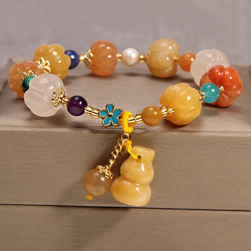 Women's multi-layer crystal bracelet with natural garnet, strawberry quartz, and moonstone pendants in Korean style.