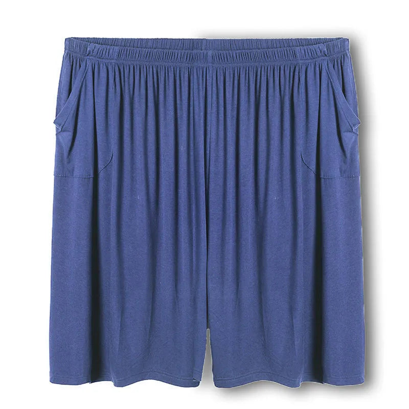 Plus-sized man wearing black loose fit modal sports trousers