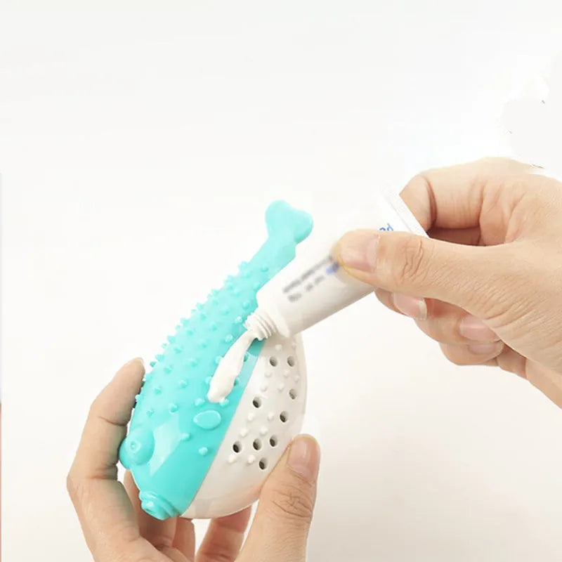 Blue silicone fish-shaped chew toy for cats on a plain background